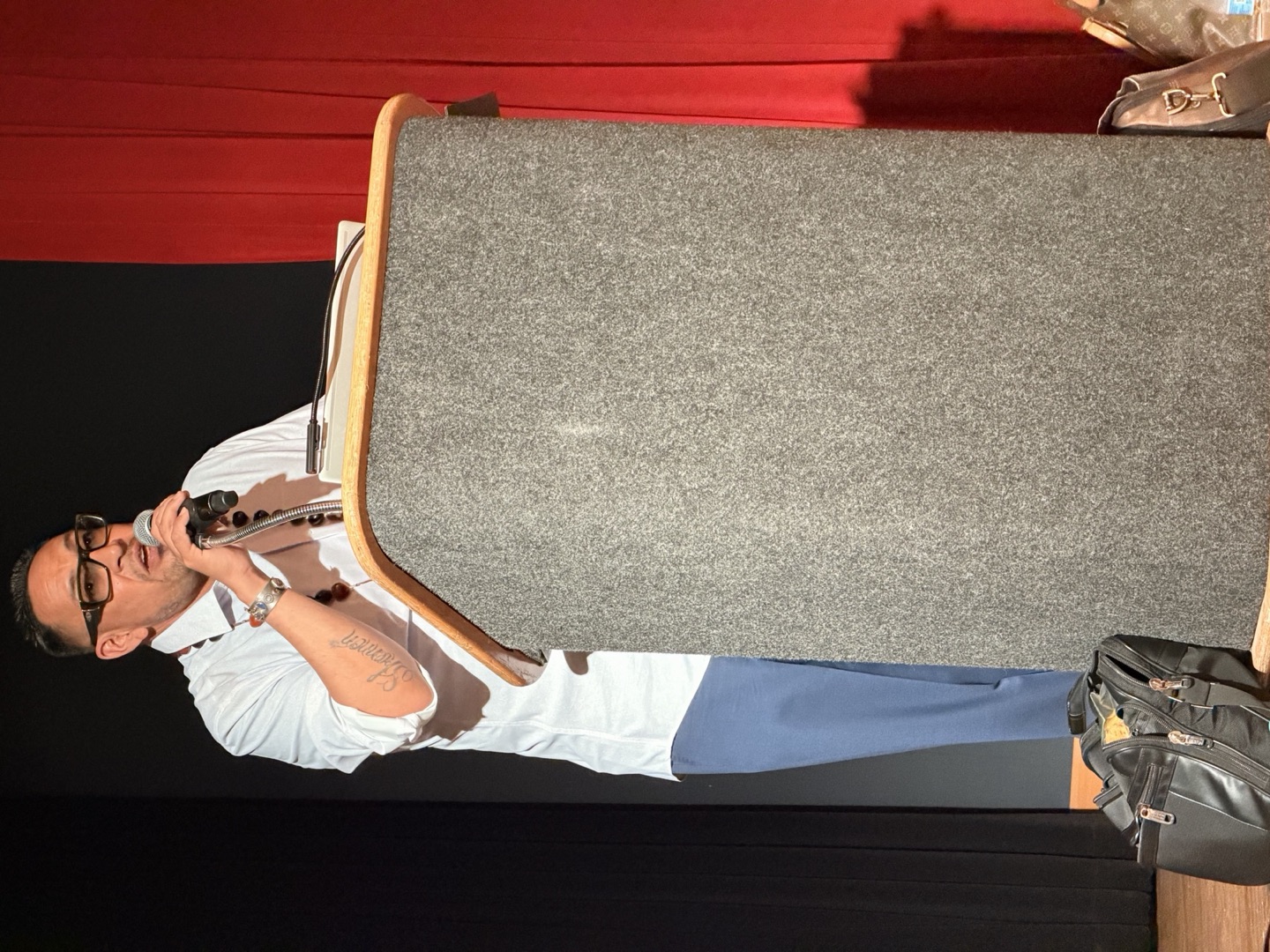 Adam Griego speaking from a podium